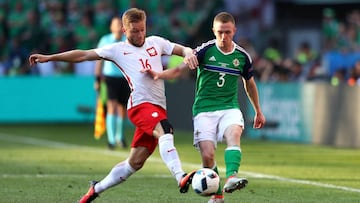 NICE, FRANCE - JUNE 12: Jakub Blaszczykowski of Poland and Shane Ferguson of Northern Ireland compete for the ball during the UEFA EURO 2016 Group C match between Poland and Northern Ireland at Allianz Riviera Stadium on June 12, 2016 in Nice, France. (Photo by Lars Baron/Getty Images)