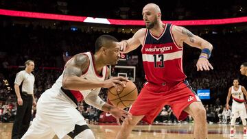 Mar 11, 2017; Portland, OR, USA; Portland Trail Blazers guard Damian Lillard (0) drives to the basket against Washington Wizards center Marcin Gortat (13) during the second half at the Moda Center. The Wizards won in overtime 125-124. Mandatory Credit: Troy Wayrynen-USA TODAY Sports