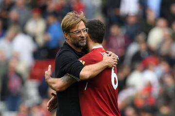 Klopp gives Dejan Lovren a hug.