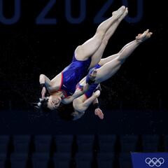 How fast do Olympic divers hit the water and how high do they dive from?