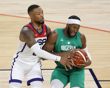 LAS VEGAS, NEVADA - JULY 10: Josh Okogie #20 of Nigeria is defended by Damian Lillard #6 of the United States during an exhibition game at Michelob ULTRA Arena ahead of the Tokyo Olympic Games on July 10, 2021 in Las Vegas, Nevada. Nigeria defeated the Un