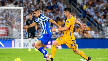 Monterrey's Argentine forward German Berterame (L) and Tigres' defender Jesus Angulo vie for the ball during the Mexican Clausura 2024 tournament football match at the BBVA Bancomer stadium in Monterrey, Mexico, on April 13, 2024. (Photo by Julio Cesar AGUILAR / AFP)