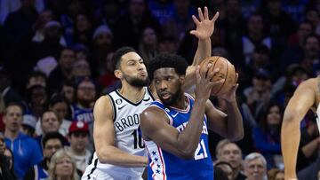 Philadelphia 76ers center Joel Embiid (21) controls the ball against Brooklyn Nets guard Ben Simmons (10) during the first quarter at Wells Fargo Center.