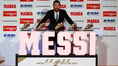 Soccer Football - FC Barcelona&#039;s Lionel Messi receives his fifth European Golden Shoe - Antiga Fabrica Estrella Damm, Barcelona, Spain - December 18, 2018   FC Barcelona&#039;s Lionel Messi poses with his five European Golden Shoe awards   REUTERS/Al