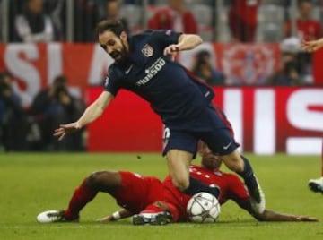 Juanfran goes to ground under a David Alaba challenge