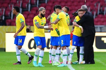 Brazil players celebrate with head coach Tite (right) after scoring in a World Cup qualifier against Ecuador earlier this month.