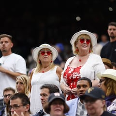 Why do fans eat strawberries and cream at Wimbledon?