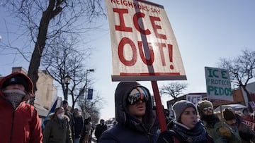 Demonstrators carry signs condemning Immigration and Customs Enforcement (ICE) near the site where a man identified as Alex Pretti was fatally shot by federal agents trying to detain him, in Minneapolis, Minnesota, U.S., January 24, 2026. REUTERS/Tim Evans
