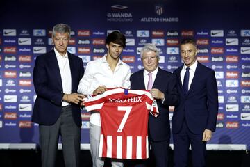 Joao Félix receives his number 7 shirt from Atlético president Enrique Cerezo and executives Miguel Ángel Gil Marín and Andrea Berta.