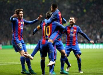 Barcelona's players celebrate Messi's opener.