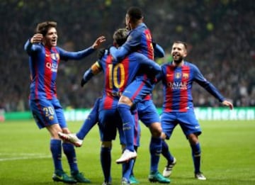 Barcelona's players celebrate Messi's opener.