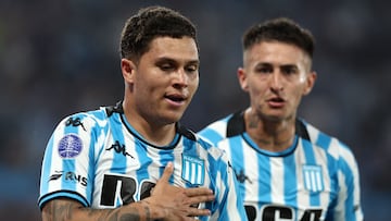 Racing's Colombian midfielder #08 Juan Fernando Quintero (L) celebrates with teammate defender #27 Gabriel Rojas after scoring during the Copa Sudamericana semi-final second leg football match between Argentina's Racing and Brazil's Corinthians at the Presidente Peron stadium in Avellaneda, Buenos Aires province, Argentina, on October 31, 2024. (Photo by ALEJANDRO PAGNI / AFP)