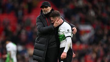 Liverpool's German manager Jurgen Klopp consoles Liverpool's Argentinian midfielder #10 Alexis Mac Allister after the English Premier League football match between Manchester United and Liverpool at Old Trafford in Manchester, north west England, on April 7, 2024. The game finished 2-2. (Photo by Paul ELLIS / AFP) / RESTRICTED TO EDITORIAL USE. No use with unauthorized audio, video, data, fixture lists, club/league logos or 'live' services. Online in-match use limited to 120 images. An additional 40 images may be used in extra time. No video emulation. Social media in-match use limited to 120 images. An additional 40 images may be used in extra time. No use in betting publications, games or single club/league/player publications. / 