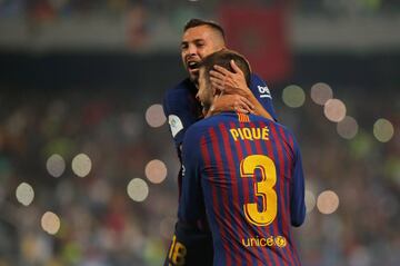 Soccer Football - Spanish Super Cup - Barcelona v Sevilla - Grand Stade de Tanger, Tangier, Morocco - August 12, 2018   Barcelona's Gerard Pique celebrates scoring their first goal with Jordi Alba   REUTERS/Jon Nazca