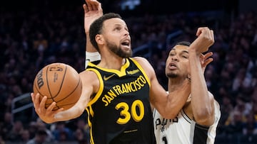 November 24, 2023; San Francisco, California, USA; Golden State Warriors guard Stephen Curry (30) shoots the basketball against San Antonio Spurs center Victor Wembanyama (1) during the third quarter at Chase Center. Mandatory Credit: Kyle Terada-USA TODAY Sports