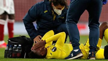 Villarreal's Nigerian midfielder Samu Chukwueze receives medical attention after appearing to pick up an injury during the UEFA Europa League semi-final, 2nd leg football match between Arsenal and Villarreal at the Emirates Stadium in London on May 6