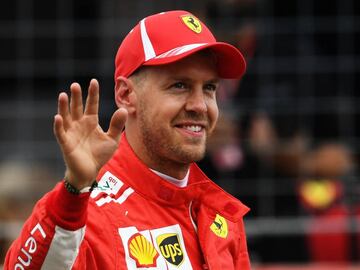 Ferrari&#039;s German driver Sebastian Vettel celebrates after the qualifying session on the eve of the German Formula One Grand Prix at the Hockenheimring Baden-W&uuml;rttemberg in Hockenheim, on July 21, 2018. 
 Sebastian Vettel surged to pole for his home German Grand Prix ahead of Bottas and Raikkonen. / AFP PHOTO / Christof STACHE