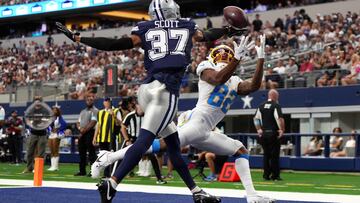 ARLINGTON, TEXAS - AUGUST 24: Eric Scott Jr. #37 of the Dallas Cowboys breaks up a pass intended for Brenden Rice #82 of the Los Angeles Chargers during the first half of a preseason game at AT&T Stadium on August 24, 2024 in Arlington, Texas. Sam Hodde/Getty Images/AFP (Photo by Sam Hodde / GETTY IMAGES NORTH AMERICA / Getty Images via AFP)