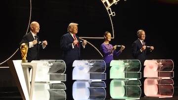 (From L) FIFA President Gianni Infantino, US President Donald Trump, Mexico's President Claudia Sheinbaum and Canada's Prime Minister Mark Carney pose with their cards during the draw for the 2026 FIFA Football World Cup taking place in the US, Canada and Mexico, at the Kennedy Center, in Washington, DC, on December 5, 2025. (Photo by Dan Mullan / POOL / AFP)