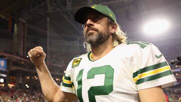 (FILES) In this file photo taken on October 28, 2021, Quarterback Aaron Rodgers #12 of the Green Bay Packers walks off the field following the NFL game at State Farm Stadium in Glendale, Arizona. - Green Bay Packers star Aaron Rodgers denied lying about