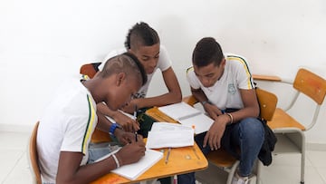 Cali, Colombia - March 01, 2015: Students work together during class in a catholic school in the neighborhood in El Vergel in Cali in Colombia (Photo by Christian Ender/Getty Images)