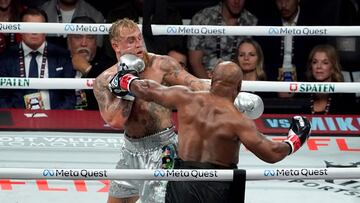 US retired pro-boxer Mike Tyson (R) and US YouTuber/boxer Jake Paul (L) fight during the heavyweight boxing bout at The Pavilion at AT&T Stadium in Arlington, Texas, November 15, 2024. (Photo by TIMOTHY A. CLARY / AFP)