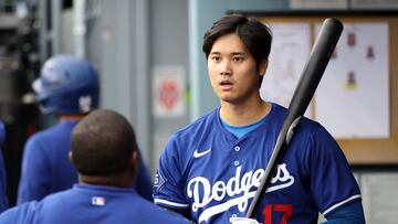 Mar 24, 2024; Los Angeles, California, USA;  Los Angeles Dodgers designated hitter Shohei Ohtani (17) holds a bat in the dugout prior to the game against the Los Angeles Angels at Dodger Stadium. Mandatory Credit: Kiyoshi Mio-USA TODAY Sports