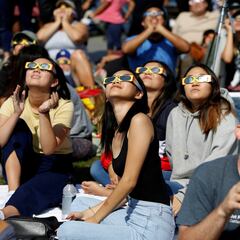 What is a total solar eclipse and how often does it occur?