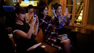 People take phone pictures at a screening of Prada Spring/Summer 2021 Womenswear Fashion Show at Prada's Rong Zhai residence, following the coronavirus disease (COVID-19) outbreak, in Shanghai, China September 24, 2020. Picture taken September 24, 2020. REUTERS/Aly Song