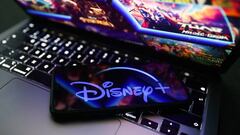 Disney+ logo displayed on a phone screen and Disney+ website displayed on a laptop screen are seen in this illustration photo taken in Krakow, Poland on November 27, 2022. (Photo by Jakub Porzycki/NurPhoto via Getty Images)