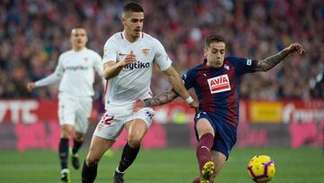 Sevilla's Portuguese forward Andre Silva (L) fights for the ball with Eibar's Spanish defender Ruben Pena during the Spanish league football match Sevilla FC against SD Eibar at the Ramon Sanchez Pizjuan stadium in Sevilla on February 10, 2019.