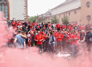 Liverpool fans get the flares out.