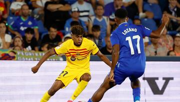 Barcelona's Spanish forward #27 Lamine Yamal vies with Getafe's Honduran forward #17 Anthony Lozano during the Spanish Liga football match between Getafe CF and FC Barcelona at the Col. Alfonso Perez stadium in Getafe on August 13, 2023. (Photo by JAVIER SORIANO / AFP)