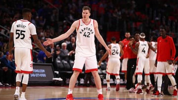DETROIT, MI - APRIL 09: Jakob Poeltl #42 of the Toronto Raptors celebrates with Delon Wright #55 after a Detroit Pistons called timeout at Little Caesars Arena on April 9, 2018 in Detroit, Michigan. Toronto won the game 108-98. NOTE TO USER: User expressl