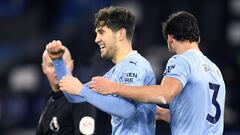 17 January 2021, England, Manchester: Manchester City&#039;s John Stones (L) celebrates scoring his side&#039;s third goal with teammate Ruben Dias during the English Premier League soccer match between  Manchester City and Crystal Palace at the Etihad St