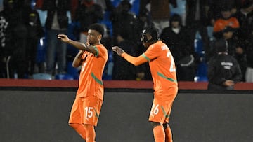 Ivory Coast's forward #15 Amad Diallo (L) celebrates scoring the team's first goal with Ivory Coast's forward #26 Yan Diomande during the Africa Cup of Nations (CAN) Group F football match between Ivory Coast and Mozambique at Marrakesh Stadium in Marrakesh on December 24, 2025. (Photo by Khaled DESOUKI / AFP)