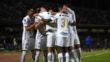 Pumas' Argentinian forward Juan Dinenno (C) celebrates with teammates after scoring against Cruz Azul during their first leg semi-final CONCACAF Champions League football match at the University Olympic stadium in Mexico City, April 5, 2022. (Photo by PEDRO PARDO / AFP)