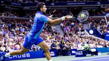 Serbia's Novak Djokovic plays a forehand return against France's Alexandre Muller during the US Open tennis tournament men's singles first round match at the USTA Billie Jean King National Tennis Center in New York City, on August 28, 2023. (Photo by COREY SIPKIN / AFP)