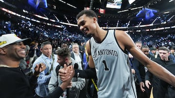 Dec 13, 2025; Las Vegas, Nevada, USA; San Antonio Spurs forward Victor Wembanyama (1) celebrates with Chris Paul after the game against the Oklahoma City Thunder at T-Mobile Arena. Mandatory Credit: Kirby Lee-Imagn Images