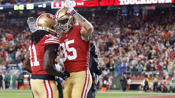 SANTA CLARA, CALIFORNIA - JANUARY 20: George Kittle #85 of the San Francisco 49ers celebrates with Brandon Aiyuk #11 after scoring a 32-yard touchdown during the second quarter against the Green Bay Packers in the NFC Divisional Playoffs at Levi's Stadium on January 20, 2024 in Santa Clara, California. Lachlan Cunningham/Getty Images/AFP (Photo by Lachlan Cunningham / GETTY IMAGES NORTH AMERICA / Getty Images via AFP)