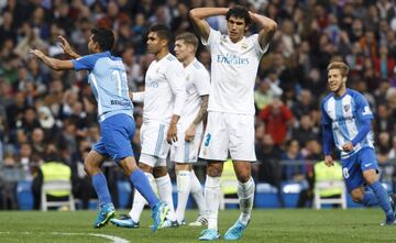 Castro wheels away in celebration as Jesús Vallejo laments Málaga's second leveller.