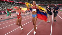 Gold medallist Venezuela&#039;s Yulimar Rojas (R), bronze medallist Spain&#039;s Ana Peleteiro (2-L) and silver medallist Portugal&#039;s Patricia Mamona (L) celebrate on the track following the women&#039;s triple jump final during the Tokyo 2020 Olympic