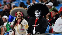 Why do people paint their face for Dia de los Muertos?