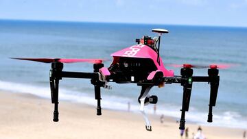 TO GO WITH AFP STORY BY JORDANE BERTRAND
(FILES) This file photo taken on July 08, 2016 shows the surveillance drone "Helper", flying over the beach of Biscarrosse, on July 8, 2016, during a demonstration of a rescue operation.
The "Helper" drone, tested this summer on the beach of Biscarrosse, can take off from a rescue centre in less than thirty seconds, be placed over a swimmer in distress and drop a life buoy. It will be used by sea rescuers on beaches. / AFP PHOTO / GEORGES GOBET