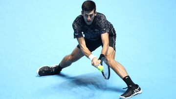 LONDON, ENGLAND - NOVEMBER 14: Novak Djokovic of Serbia plays a backhand during his singles round robin match against Alexander Zverev of Germany during Day Four of the Nitto ATP Finals at The O2 Arena on November 14, 2018 in London, England. (Photo by Julian Finney/Getty Images)