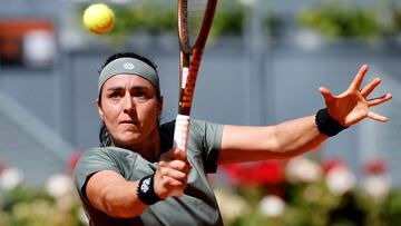 Tunisia's Ons Jabeur returns a ball to Latvia's Jelena Ostapenko during the 2024 WTA Tour Madrid Open tournament last sixteen tennis match at Caja Magica in Madrid on April 29, 2024. (Photo by OSCAR DEL POZO / AFP)