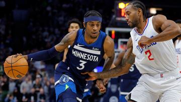 Minnesota Timberwolves forward Jaden McDaniels (3) drives to the basket around Los Angeles Clippers forward Kawhi Leonard (2) in the first quarter at Target Center.