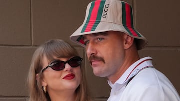 (FILES) US singer-songwriter Taylor Swift (L) and boyfriend US NFL football player Travis Kelce attend the men's final match between USA's Taylor Fritz and Italy's Jannik Sinner on day fourteen of the US Open tennis tournament at the USTA Billie Jean King National Tennis Center in New York City, on September 8, 2024. Pop superstar Taylor Swift and American football player Travis Kelce announced their engagement on August 26, 2025, setting the stage for a high-profile wedding for the celebrity couple. A joint post on their Instagram pages showed pictures of Kelce on one knee making his marriage proposal in a flower-laden garden, and then Swift, 35, displaying a large diamond ring. (Photo by TIMOTHY A. CLARY / AFP)