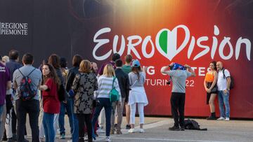 11 May 2022, Italy, Turin: Spectators stand for a photo in front of the big screen with the inscription "Eurovision" before the start of the dress rehearsal for the second semifinal at the Eurovision Song Contest (ESC). The international music competition is being held for the 66th time. On 14.05.2022 the final of the international competition will take place, a total of 40 musicians have participated. Photo: Jens Büttner/dpa (Photo by Jens Büttner/picture alliance via Getty Images)