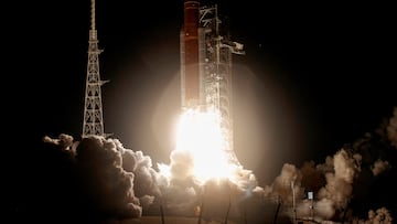 NASA's next-generation moon rocket, the Space Launch System (SLS) rocket with the Orion crew capsule, lifts off from launch complex 39-B.